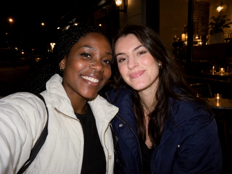 Generated direct-flash photograph of two friends outside a cafe at night — 100% strength