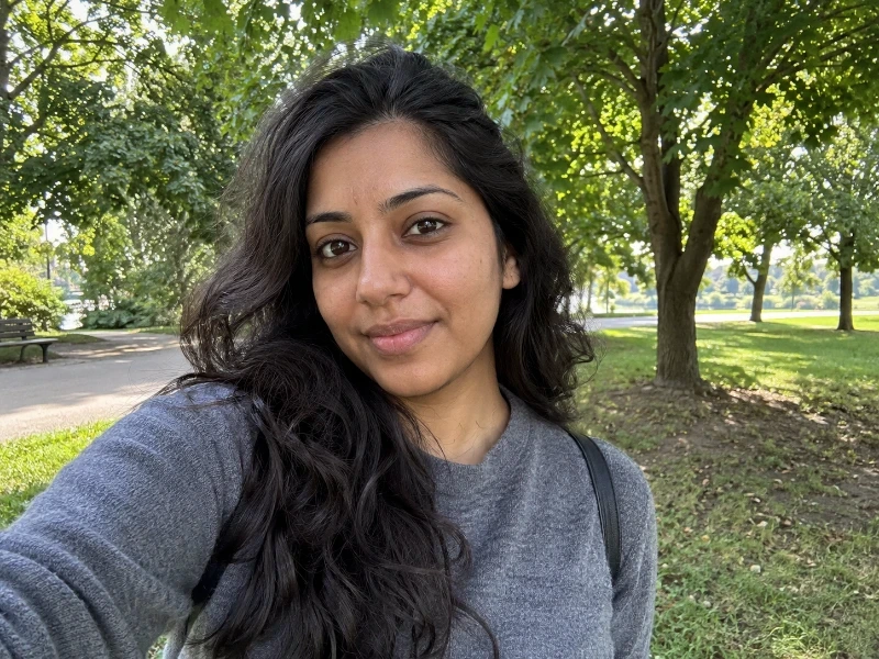 Generated daylight portrait in a park — 45% strength