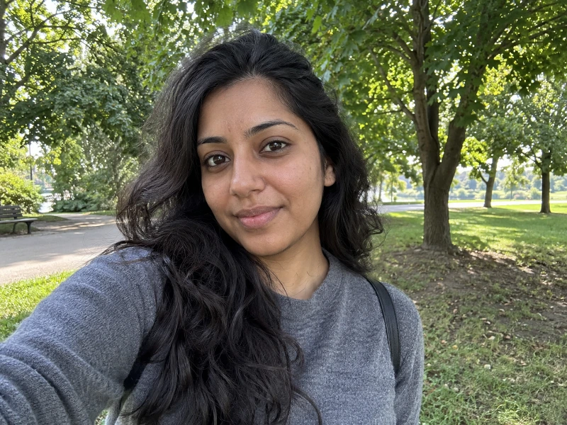 Generated daylight portrait in a park — ungraded source